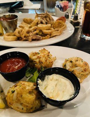 Crispy fresh fried calamari in the background. They're delish full of lump crab meat crab cakes.