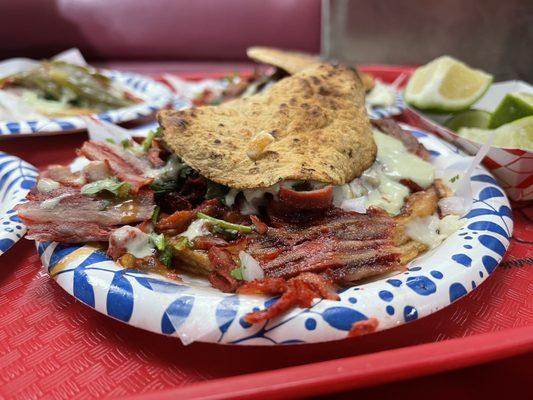 Sopes De Adobada, flavorful and tender.   Sauce is tiny hot but nice addition.