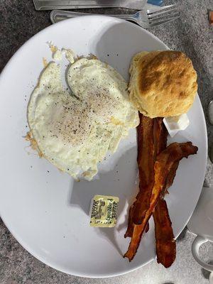 Eggs over medium, crispy bacon, humongous biscuit