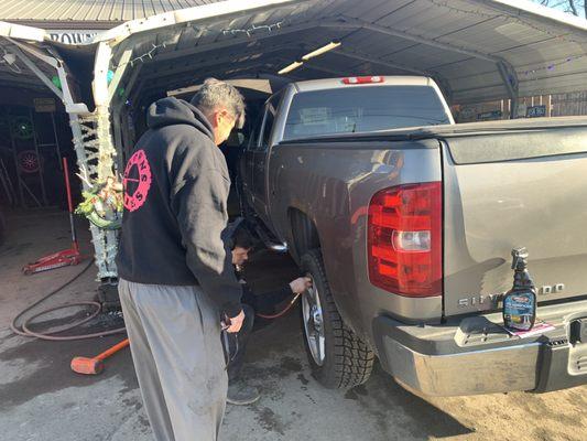 Truck getting tires installed