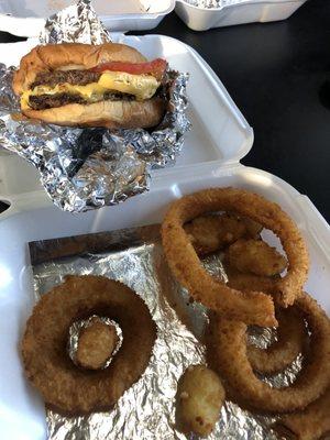 Double burger, onion rings and cheese bites.