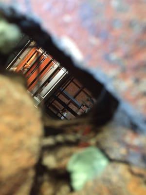 Hole in the wall peep into the depths of the Goliath Station!