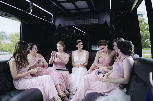 Bridal party getting ready for the big event in one of our Luxury Limo Buses