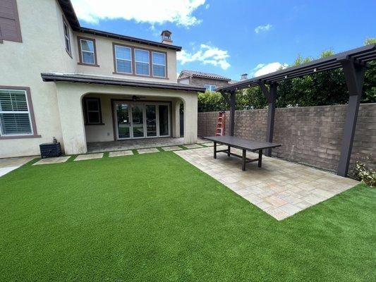 New artificial turf and a paver patio will maximize your outdoor space while minimizing your upkeep.