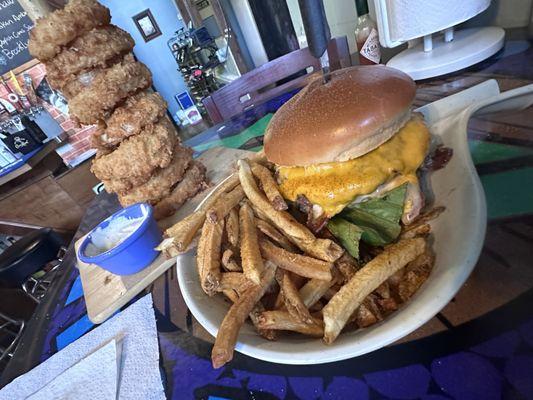 Onion ring tower in the back 606 burger and fries in the front Street. Delicious everything was fast are in good