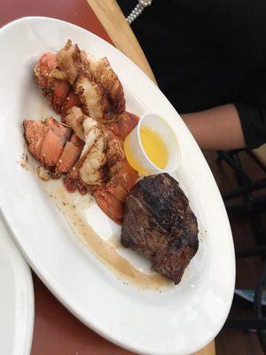 Two lobster tails and steak.