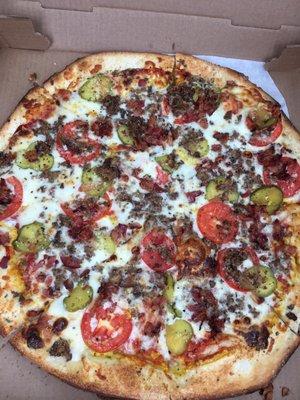 Great tasty bacon cheeseburger pizza!! Love the pickles and little tomatoes.