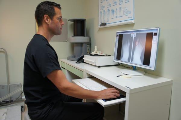 Dr. Wee reviewing patient's foot X-rays