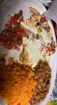 Chicken, rice, beans and pico de Gallo.