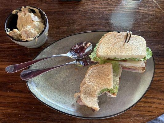 sandwich and side (nice silverware)