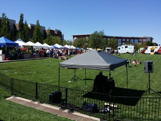 Booths line the perimeter and ioopen space in the middle