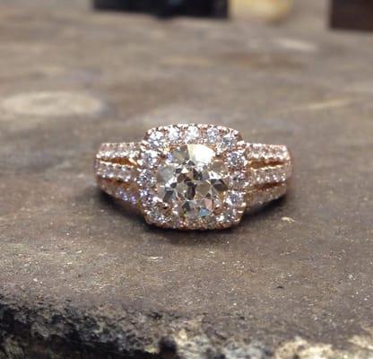 18k Rose Gold with 1.50 carat Round center diamond..setting contains 1.00 carats of round diamonds pave set!