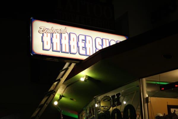 Storefront sign for Boulevard Barbers