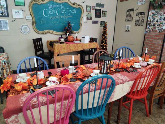 Set table (we provided the table runner, candles)