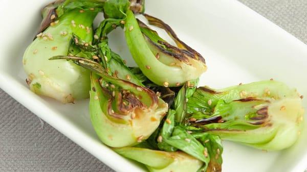 Char grilled bok choy with sesame roasted onion dressing