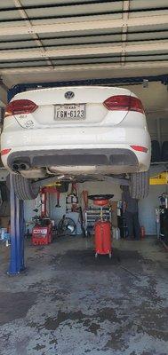 Performing a Euro full synthetic oil service and compleate vehicle  inspection..