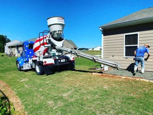 Pouring concrete for a back patio