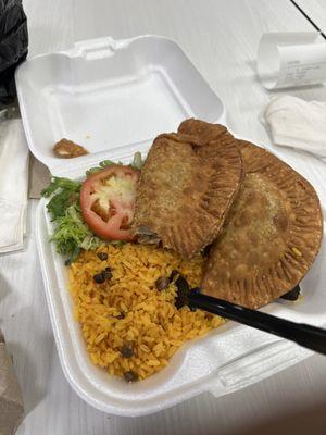 Empanada platter with yellow rice and sweet plantains