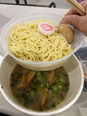 Ramen basket separate from soup so it doesn't get soggy for takeout.