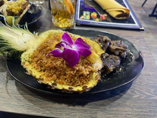 Royal Pineapple Fried Rice with jollof rice and oxtail