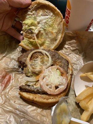 A Whopper with hardly and lettuce, a tiny slice of tomato, and a small ring of onion. Does this look like the pic that the business posted?