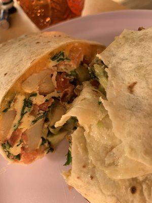 Make Build Your Own Burrito with potatoes, spinach, avocado, tomatoes and cheddar and American cheese.