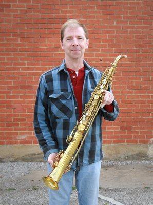 Owner Dave Schottle with the straight alto sax he created for a customer.