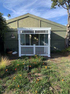 Patio/Gazebo with lights and fan on the top and roof shingles for rain protection