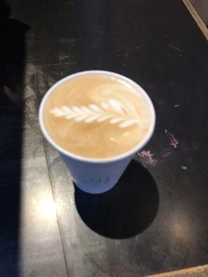 Medium latte with a lovely little latte art fern