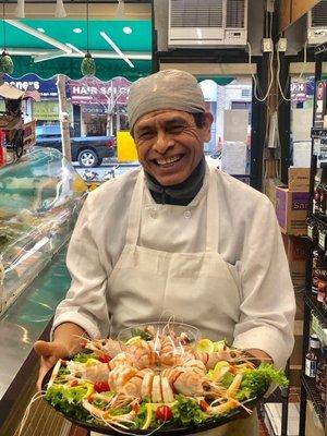 Chef Pedro with a delicious shrimp cocktail platter