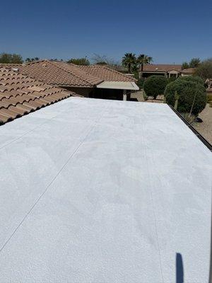 Elastomeric roof coatings after 2 coats have been applied to this flat patio roof