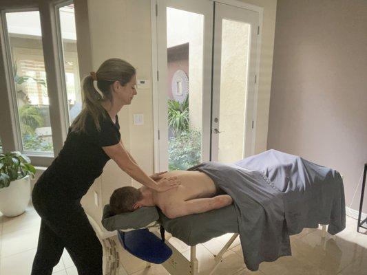 Here's how it looks to get a massage in your home.  We only need about 5ft x 10ft of space to set up our table and you get to start relaxing