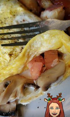 Cutting into my omelette.