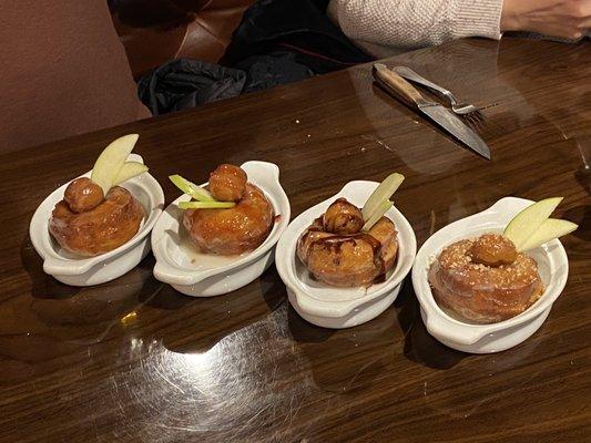 Glazed, strawberry, chocolate, and cinnamon donuts