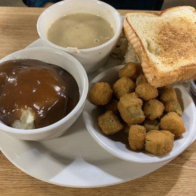 Fried okra Mash potatoes and gravy  Texas toast  Chicken and dressing under the toast