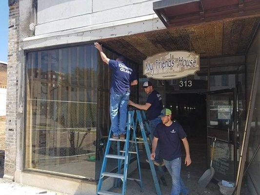 Redoing an all glass store front on Main Street in Denison