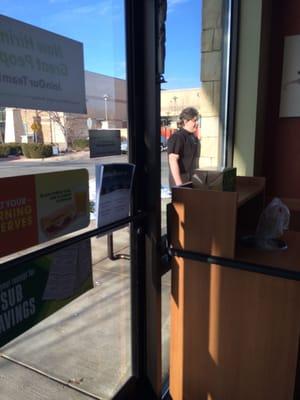 Employee smoking cigarettes next to the front door.  Guess what? He didn't wash his hands before returning to work.