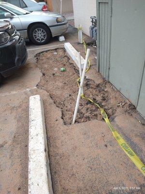 Larg holes in parking lot unfixed after water leak repair they only fix what they must and then abandon the rest,  this hole two months now