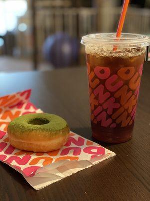 Iced coffee black and a matcha (!) donut.