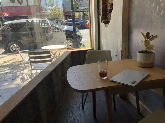 Table near window. Enjoy street views while chatting/studying!