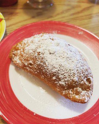 Empanada de Queso with powdered sugar