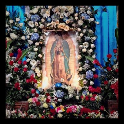 12-12-14 Our Lady of Guadalupe had many flowers from the morning Mañanitas. Very beautiful.