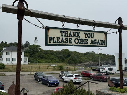 Sign (held by anchors).