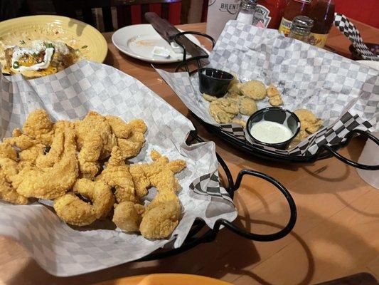 Catfish bites appetizer and the nearly eaten pickle/jalapeños.  Certain appetizers half price till 6:00 pm