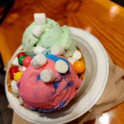 Bubble gum and marshmallows on top of mint chip cotton candy and strawberry ice cream...