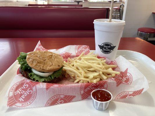 Double steak burger with fries and a shake