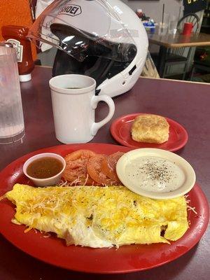 Loaded omelette, tomato slices, and biscuit w/gravy.  Absolutely delicious. The biscuit was so light & fluffy it almost floated away.