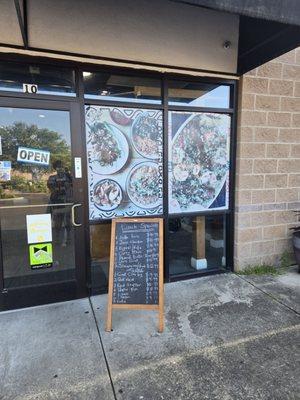 They write their most popular West African  food dishes down on a cute caulk board in front of their restaurant.