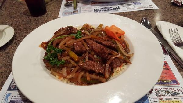 Teriyaki beef strips with onions & green peppers over rice