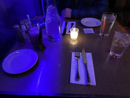 Table set up with lit-up plexiglass